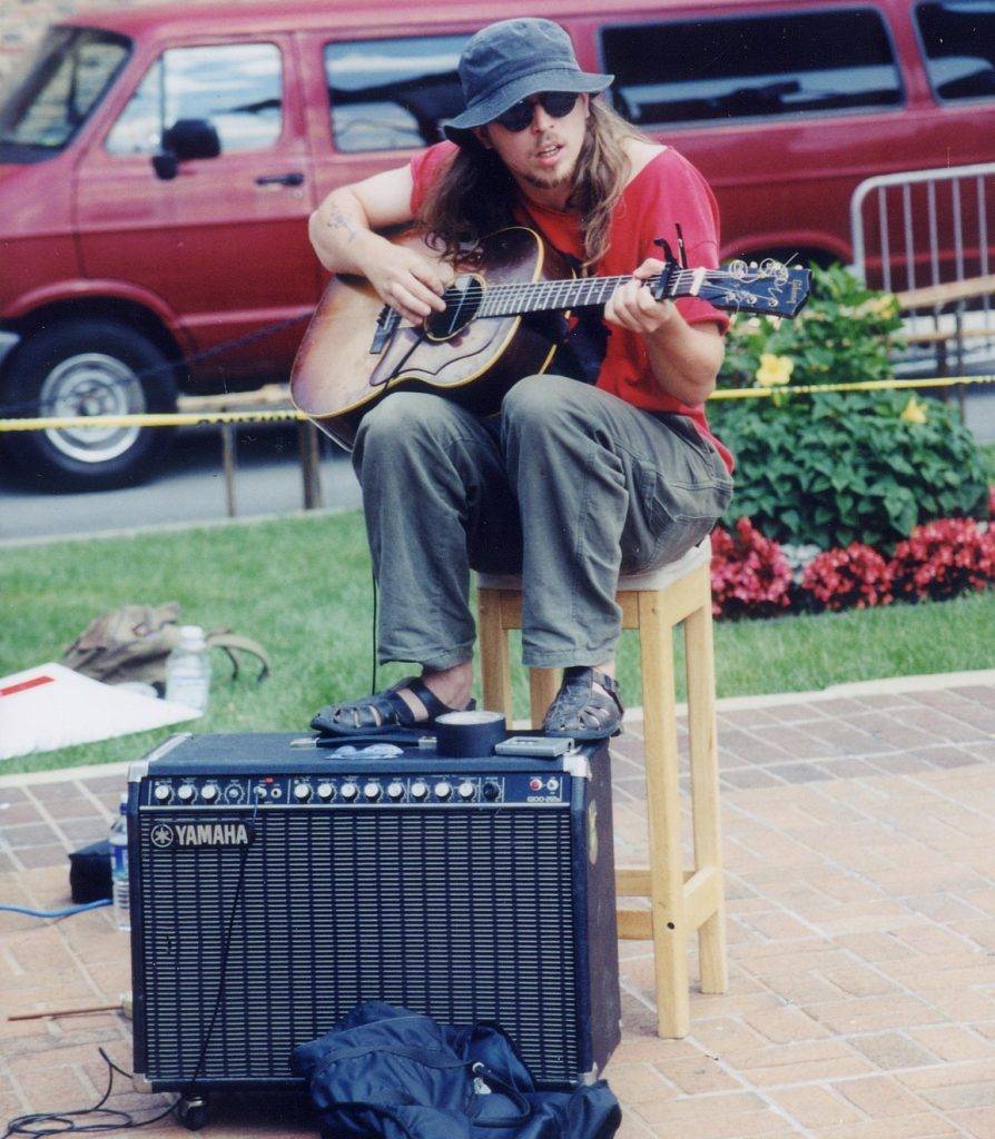 Jeremiah Scott Clark performs with aminibigcircus at Baltimore's Artscape 2000